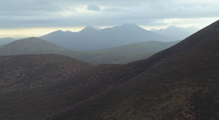 Scenic view of mountains with a cloudy sky