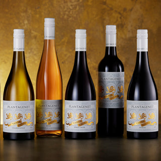 Seven bottles of Plantagenet wine arranged in a row against a textured brown background.
